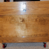 Dimensions are 25 inches deep, 34 inches long and 29 inches high;  with the wheels, the height is 31 inches.